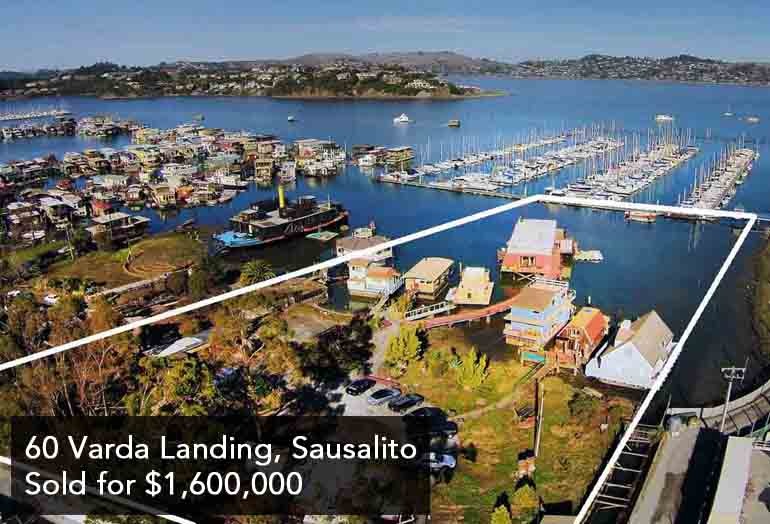Rarely available waterfront lot with income from houseboat slips, classic barge, and land based cottage.